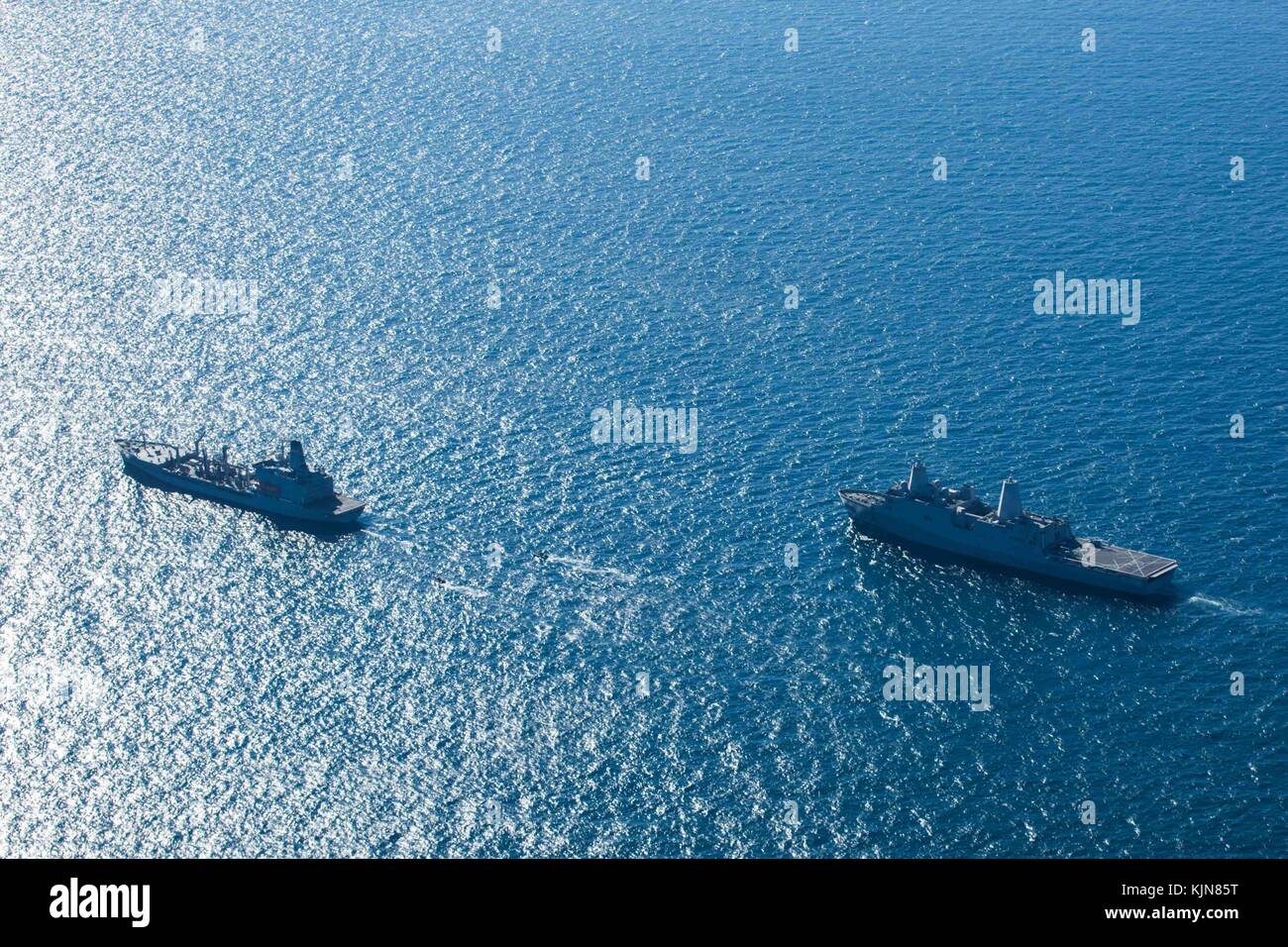 U.S. Marines with the Maritime Raid Force (MRF), 26th Marine Expeditionary Unit (MEU), and Sailors with the Iwo Jima Amphibious Ready Group (ARG) part Stock Photo