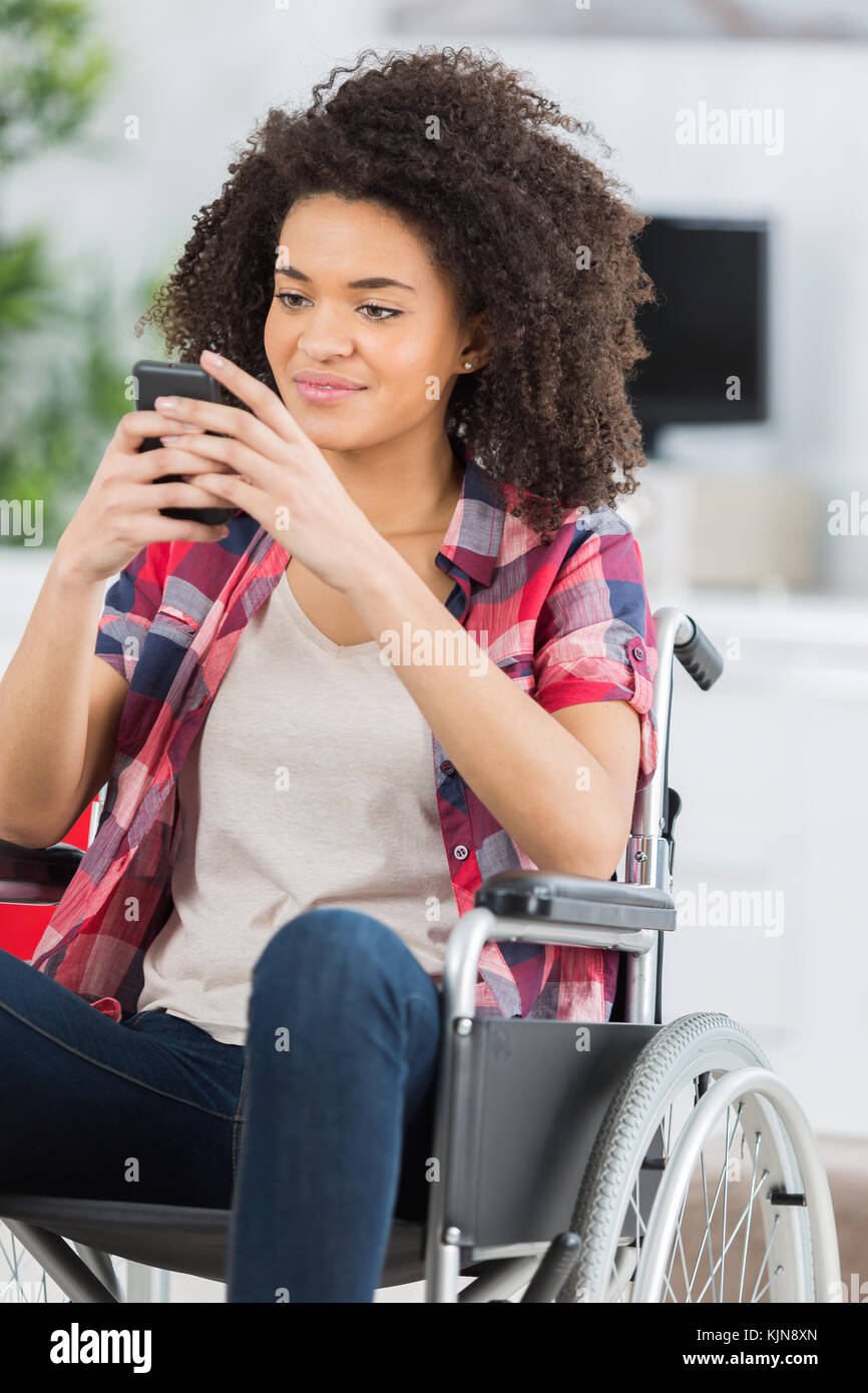 disabled woman in a wheelchair on the phone Stock Photo - Alamy