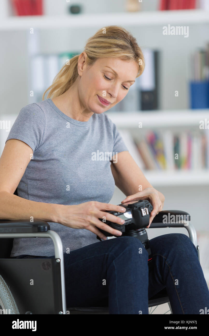 female photographer on wheelchair Stock Photo