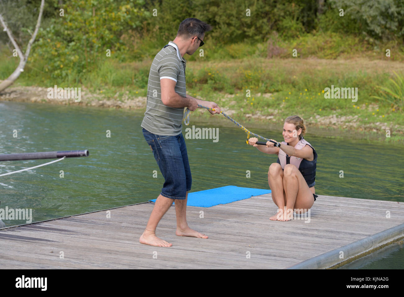 young woman learning to wakeboarding Stock Photo Alamy