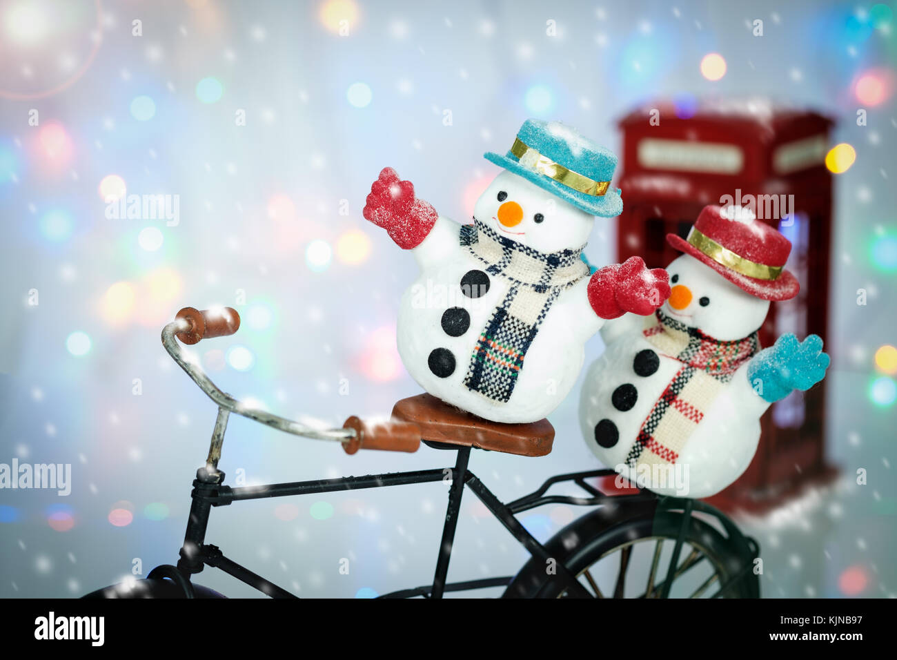 Snowman Cycling in the snow on bokeh background with copy space for season  greeting Merry Christmas, AF point selection and Add lenses Flare Stock  Photo - Alamy