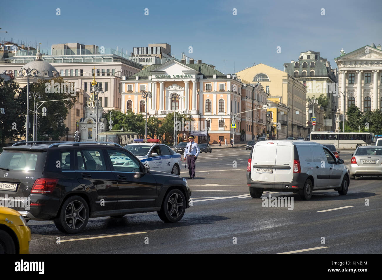 A police officer stands near traffic in Borovitskaya Ploshchad, Moscow, Russia. Stock Photo