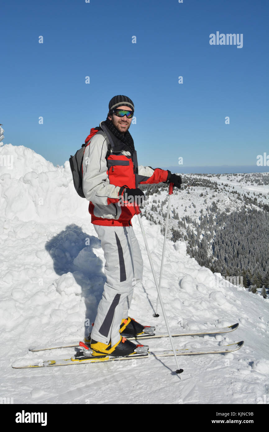 Healthy lifestyle, winter recreation, young good looking sportsman enjoying sun in cold, clear winter day, Mt.Kopaonik, Serbia Stock Photo