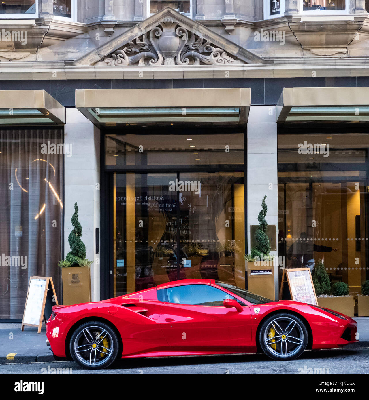 Ferrari parked outside Hilton Hotel Edinburgh in Old Town of Edinburgh, Scotland, United Kingdom Stock Photo