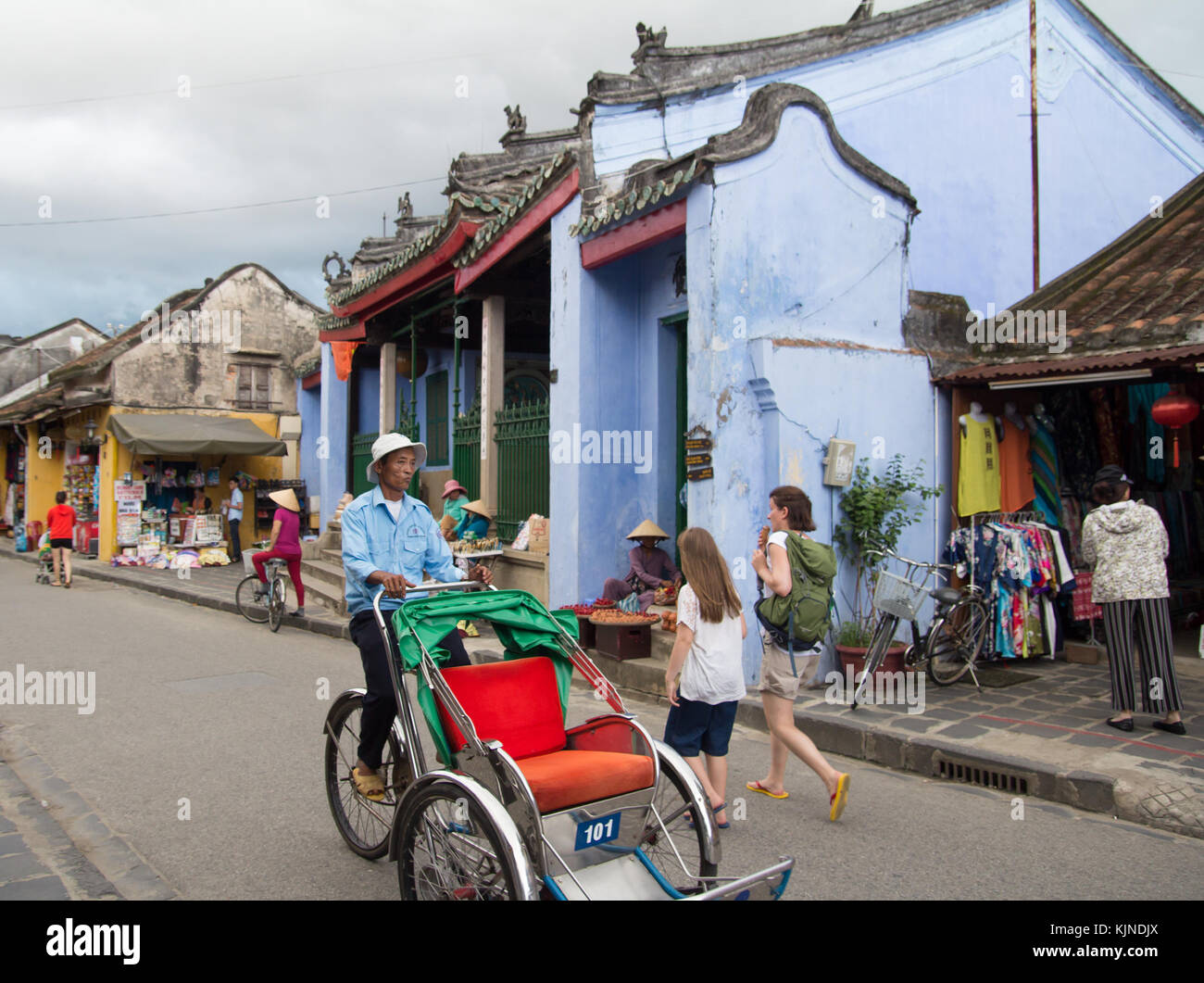 Hoi An, Vietnam - June 2017: cyclo rickshaw driving on street in Hoi An Vietnam Stock Photo