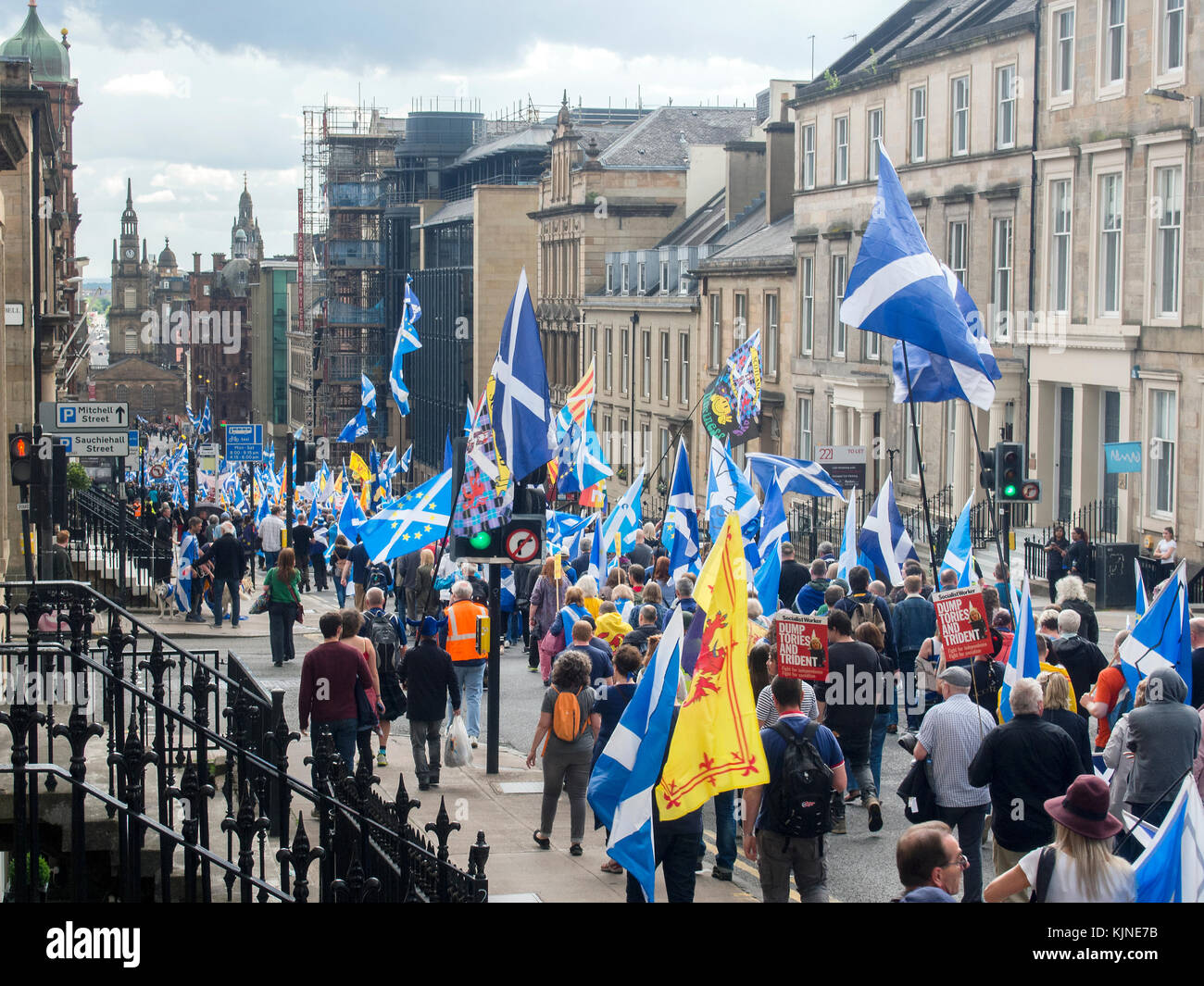 GLASGOW, SCOTLAND- JUNE 03 2017: A crowd of people march towards George