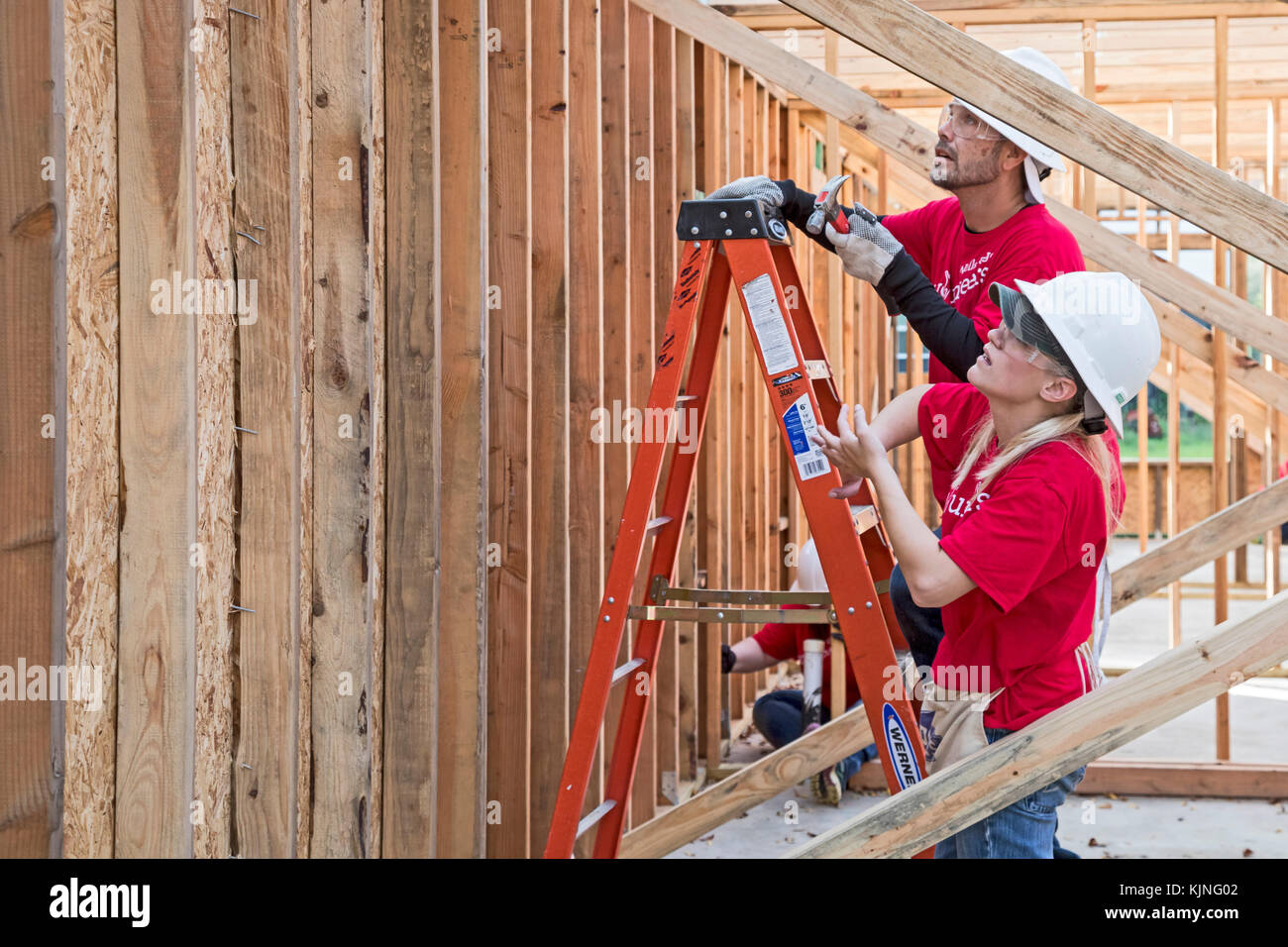 Houston, Texas - Volunteers from Wells Fargo Bank help build a Habitat for Humanity house for a low-income family. The need for affordable housing in  Stock Photo