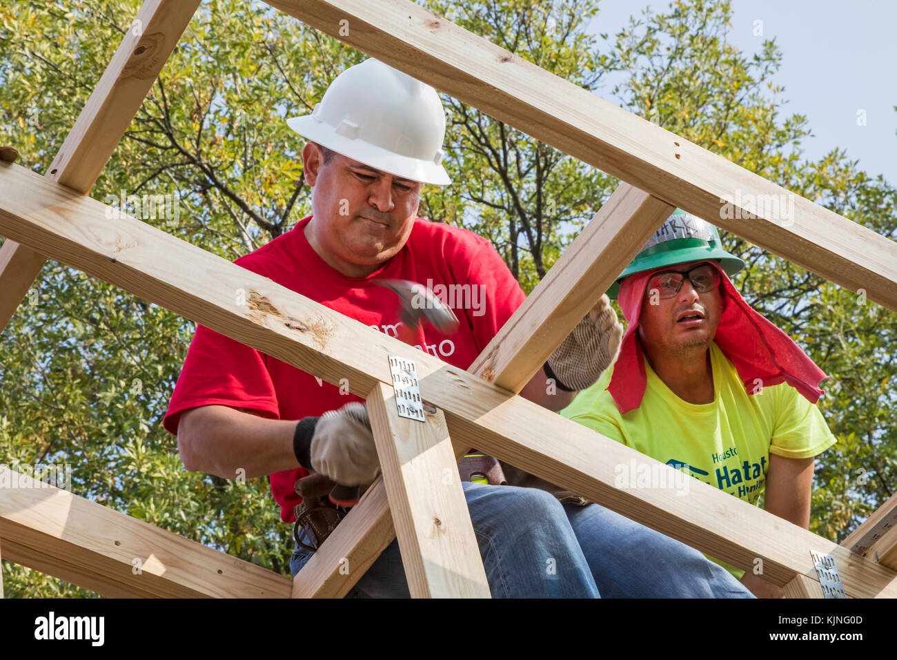 Houston, Texas - Volunteers from Wells Fargo Bank help build a Habitat for Humanity house for a low-income family. The need for affordable housing in  Stock Photo