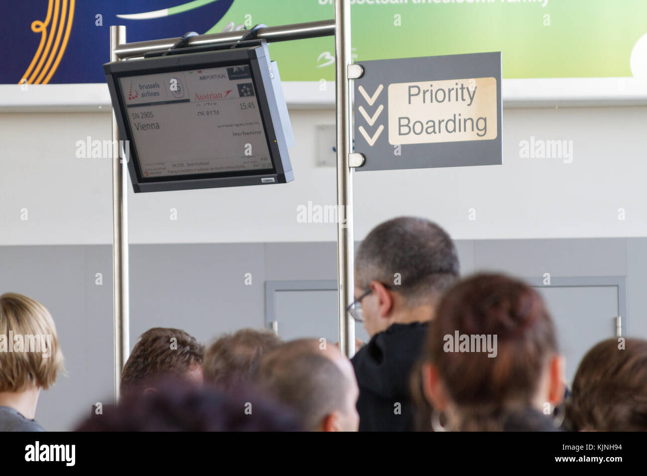 Brussels, Belgium. October 27 2017. Screen with a scheduled flight to Vienna and Priority Boarding sign at Zaventem Brussels Airport. Stock Photo