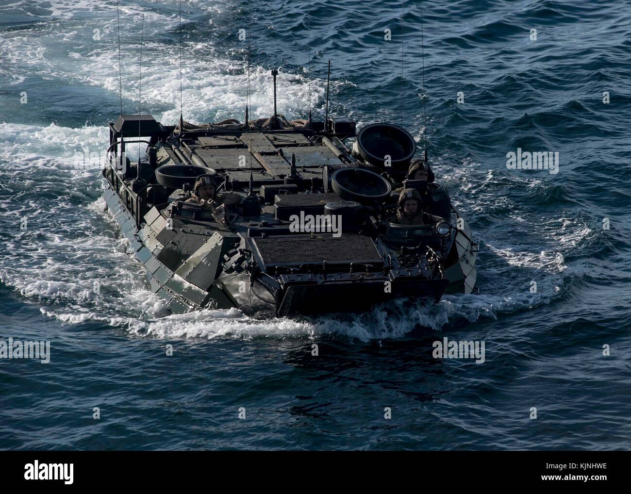 An amphibious assault vehicle approaches the well deck of the dock landing ship USS Oak Hill (LSD Stock Photo