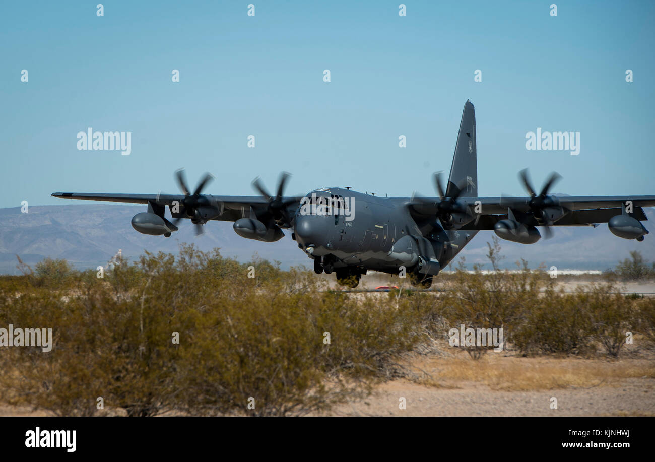 U.S. Air Force C-130 Hercules lands on an expeditionary runway set-up by U.S. Marines with Marine Air Control Squadron 1, Marine Air Traffic Control Stock Photo