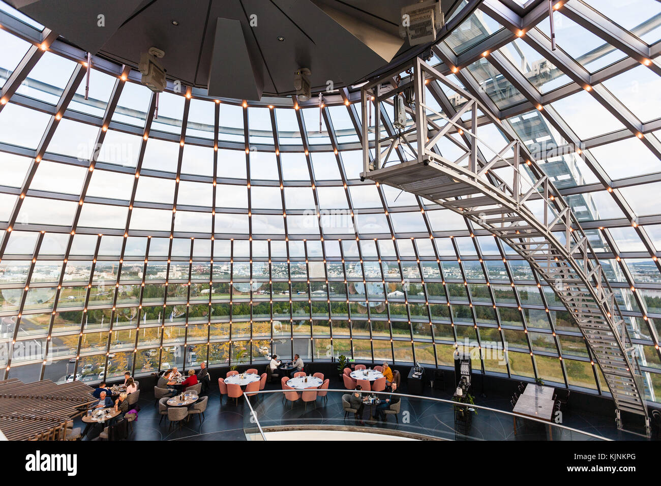 REYKJAVIC, ICELAND - SEPTEMBER 7, 2017: people in cafe inside glass dome on Observation Deck of Perlan Museum in Reykjavik city in evening. The Perlan Stock Photo