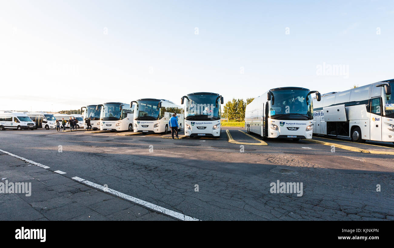 REYKJAVIC, ICELAND - SEPTEMBER 8, 2017: drivers and tourists in the parking lot of Reykjavik excursions buses at BSI Bus Terminal in autumn morning. B Stock Photo