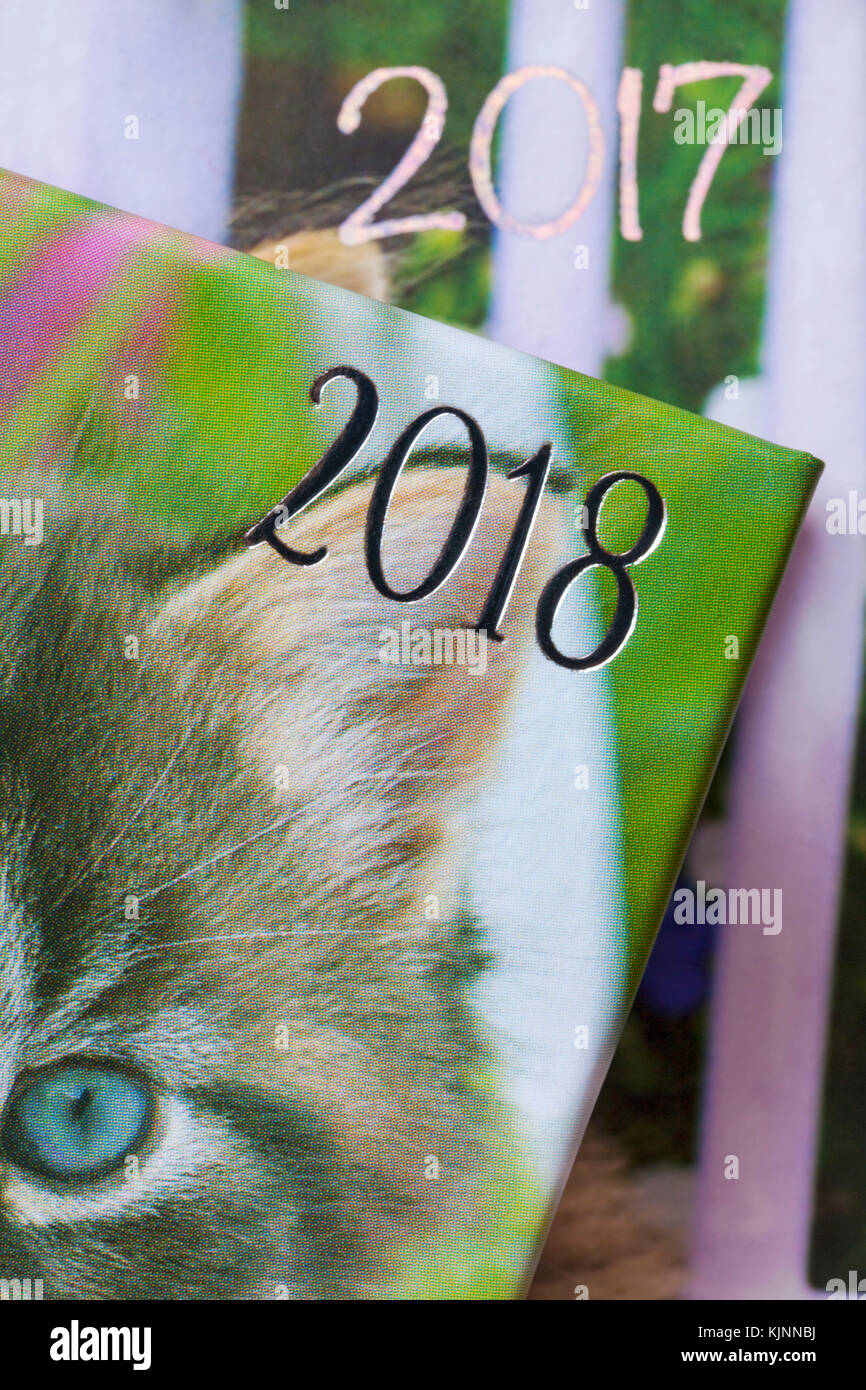 years showing on 2018 and 2017 diaries with 2018 in front and 2017 behind - concept moving into 2018 and leaving 2017 behind - leaving the past behind Stock Photo