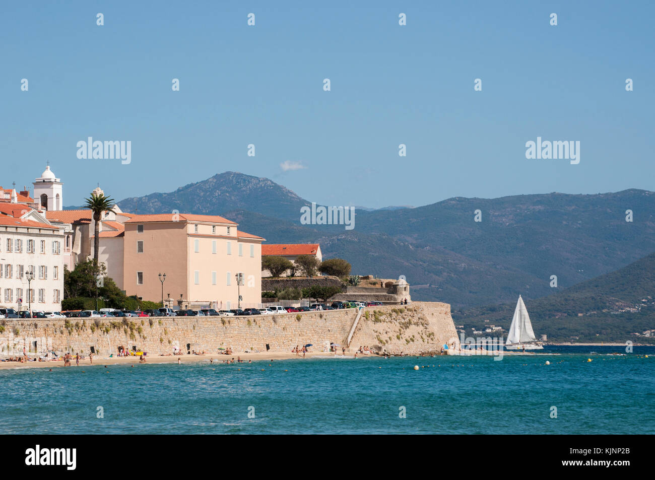 Ajaccio, Corsica: ancient walls of the 15th century Citadel, military fortress and prison during World War II, the Mediterranean Sea and urban beach Stock Photo