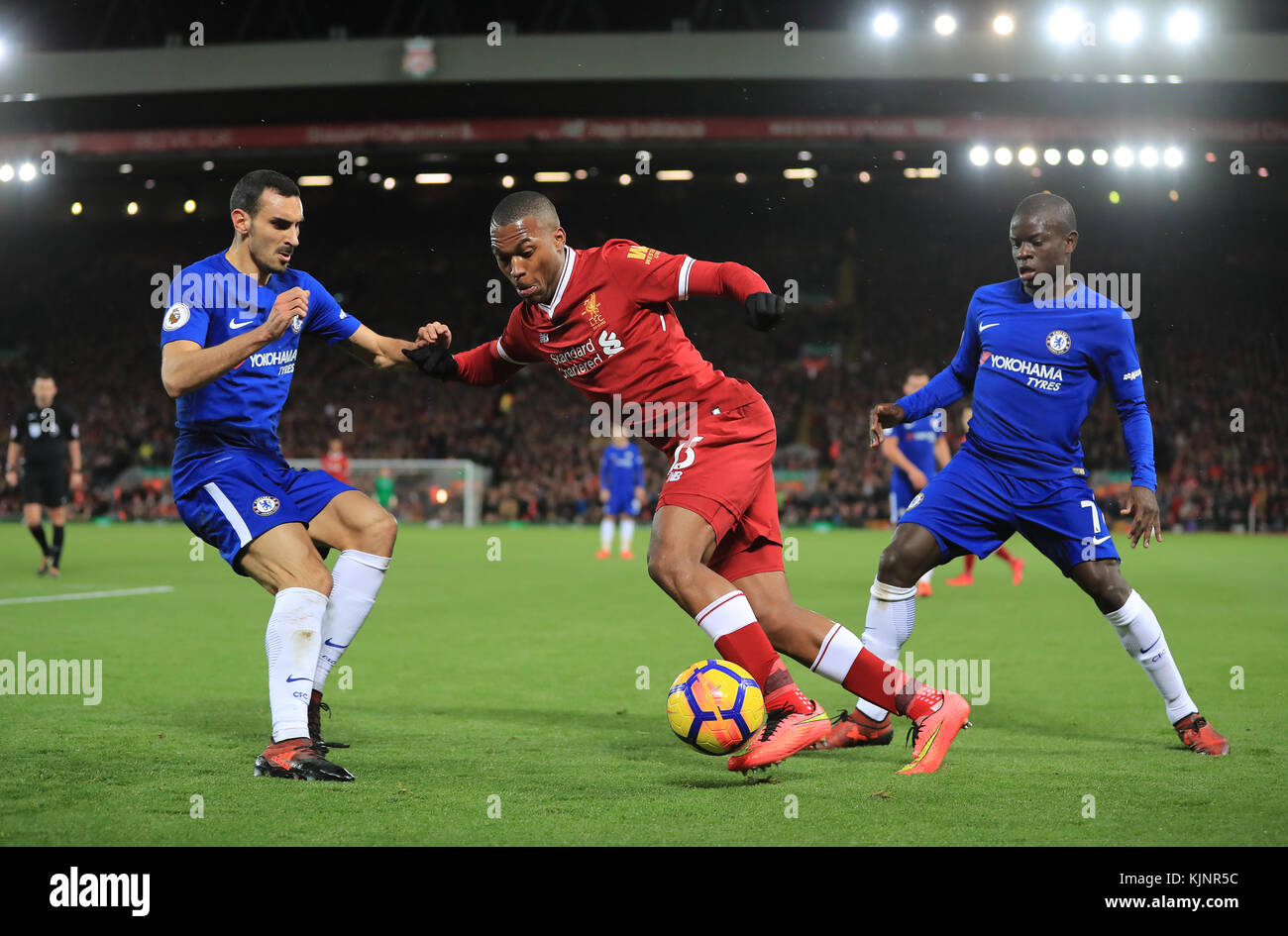 Liverpool's Daniel Sturridge (centre) in action with Chelsea's Davide Zappacosta (left) and N'Golo Kante battle for the ball during the Premier League match at Anfield, Liverpool. Stock Photo