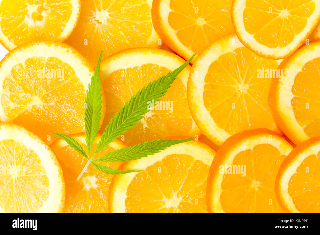 Bunch of orange fruit slices and marijuana leaf Stock Photo Alamy