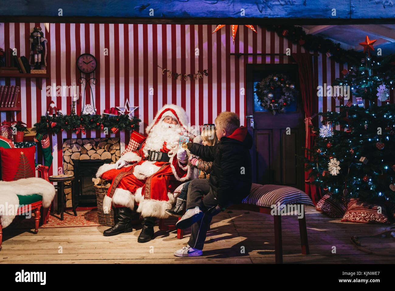 Children meeting Santa Claus at Winter Wonderland, annual Christmas Fair in London, UK Stock 