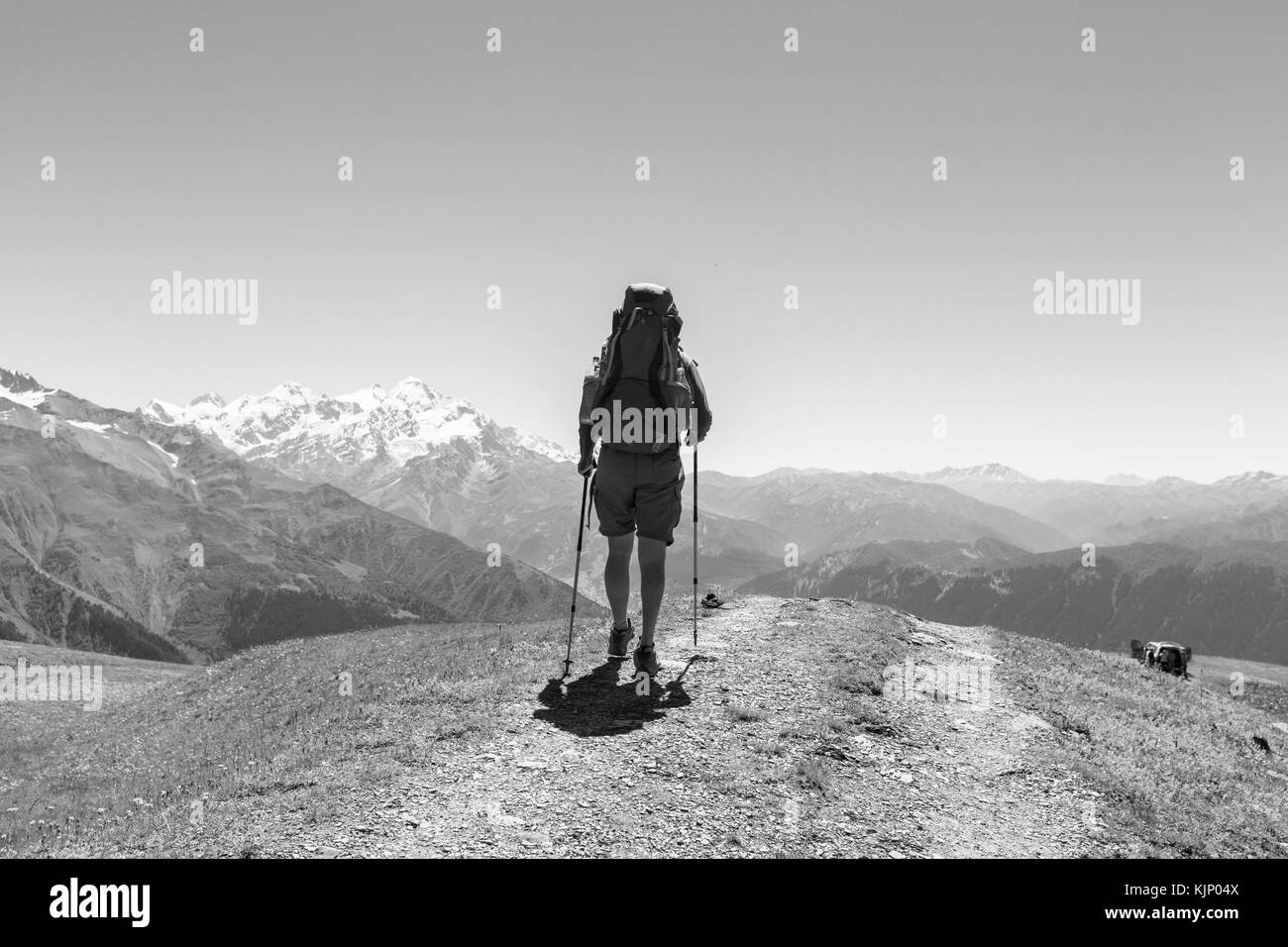 Backpacker walking Black and White Stock Photos & Images - Alamy
