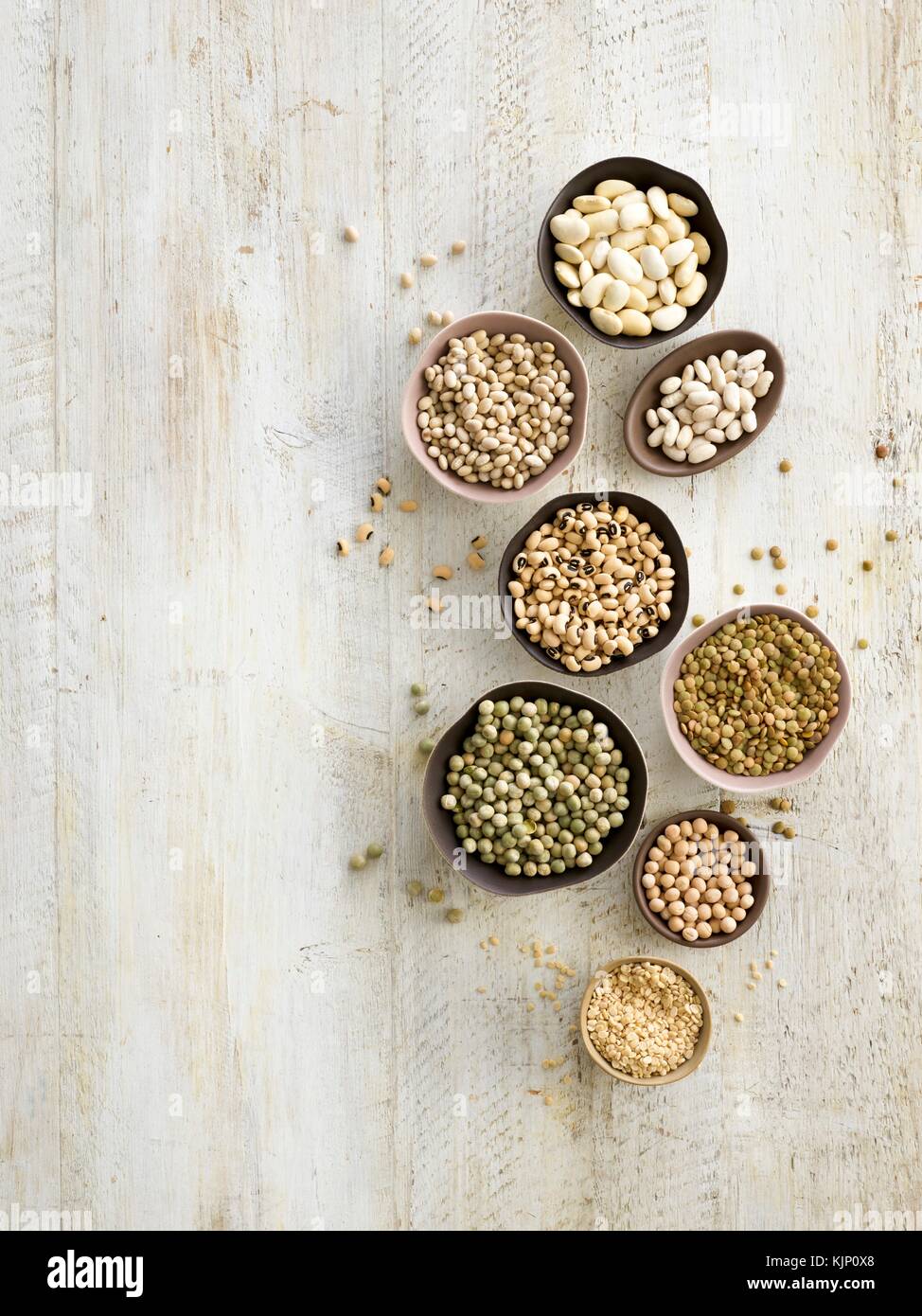 Pulses in bowls, overhead view. Stock Photo