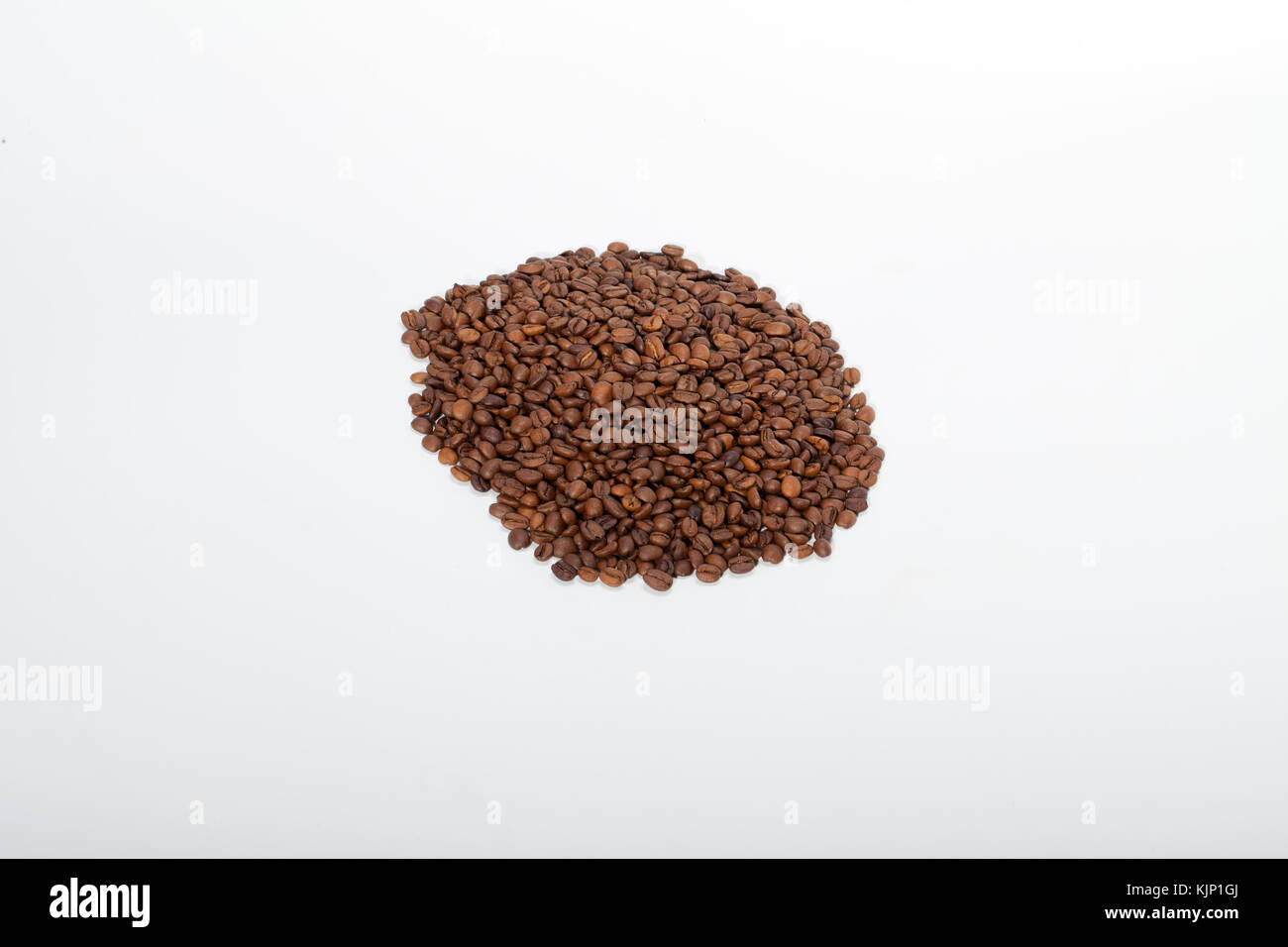 coffee beans close up isolated on white Stock Photo - Alamy