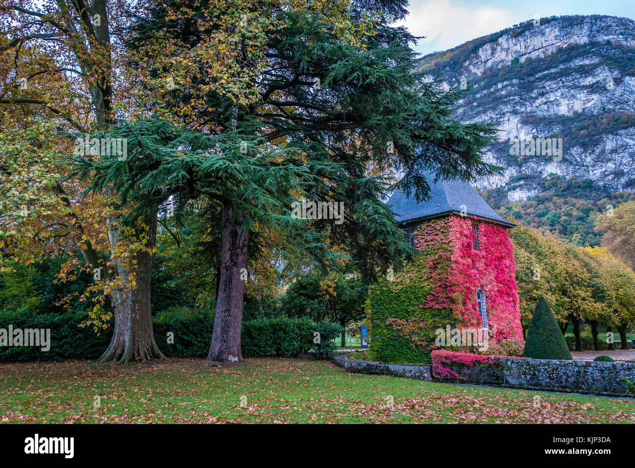 Sassenage castle in France in the autumn with splendid colors in the trees Stock Photo