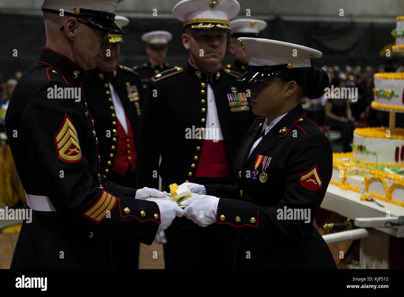 Staff Sgt. William D. Henley Jr., 47, presents a slice of cake to Lance
