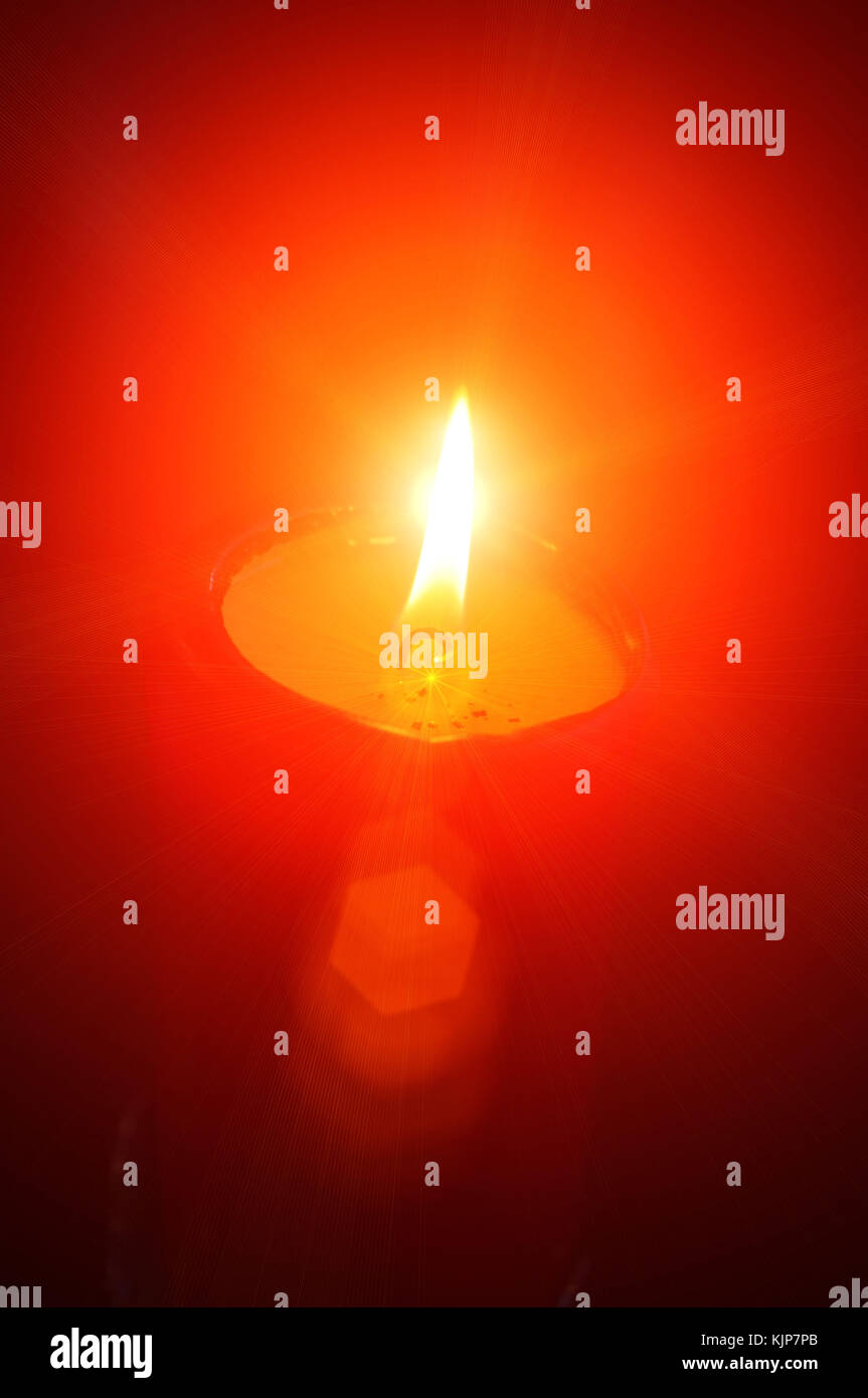 Closeup of burning candle isolated on black background Stock Photo - Alamy