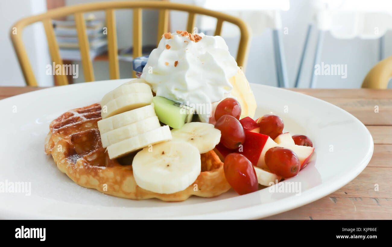 waffle with ice cream and fruit topping Stock Photo Alamy