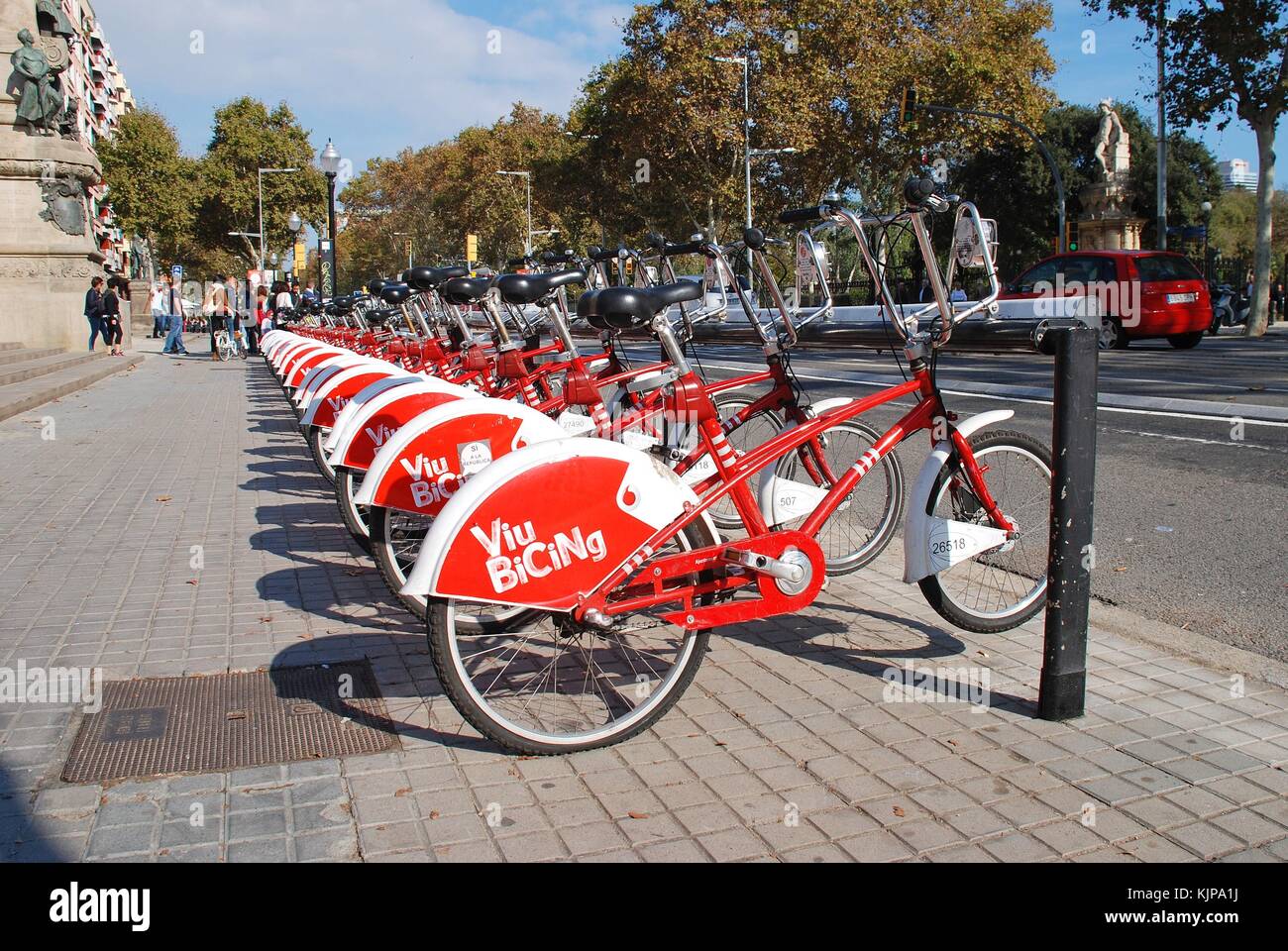 A row of bicycles on a Viu Bicing station in Barcelona, Spain on November 1, 2017. The cycle sharing scheme was started by the City council in 2007. Stock Photo
