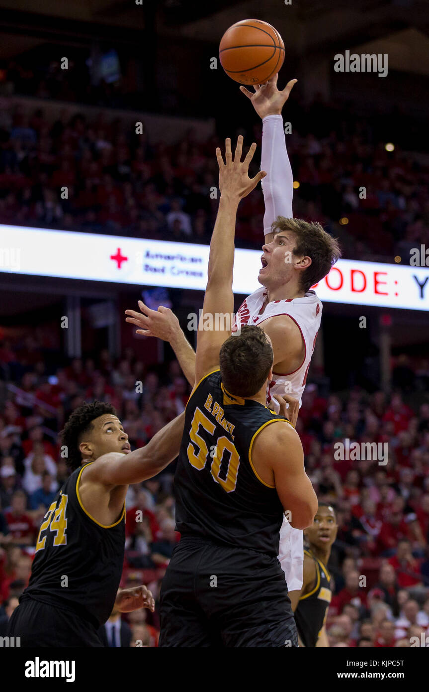 Madison, WI, USA. 24th Nov, 2017. Wisconsin Badgers forward Ethan Happ #22 scores over Milwaukee Panthers forward Brett Prahl #50 during the NCAA Basketball game between the UW-Milwaukee Panthers and the Wisconsin Badgers at the Kohl Center in Madison, WI. Wisconsin defeated UW-Milwaukee 71-49. John Fisher/CSM/Alamy Live News Stock Photo