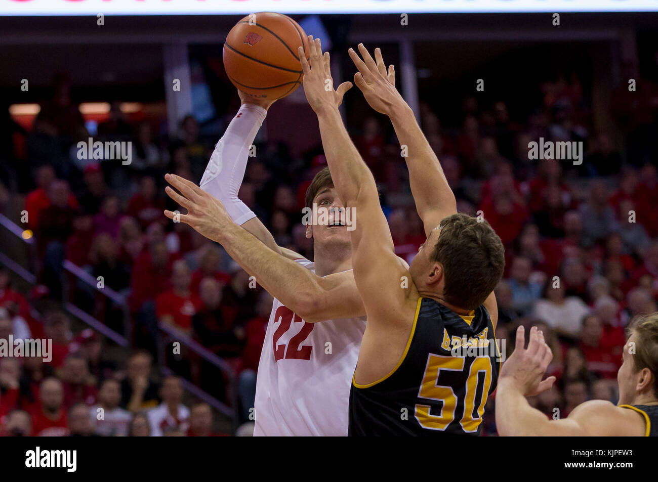 Madison, WI, USA. 24th Nov, 2017. Wisconsin Badgers forward Ethan Happ #22 shoots over Milwaukee Panthers forward Brett Prahl #50 during the NCAA Basketball game between the UW-Milwaukee Panthers and the Wisconsin Badgers at the Kohl Center in Madison, WI. Wisconsin defeated UW-Milwaukee 71-49. John Fisher/CSM/Alamy Live News Stock Photo