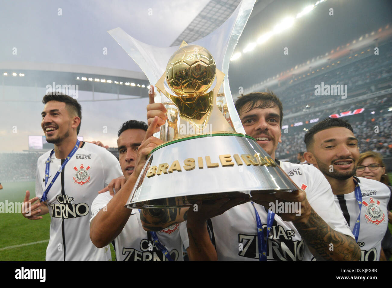 Sao Paulo, Brazil. 26th Nov, 2017. Fagner, Jadson and Clayson holds the trophy after the team defeats Atletico Mineiro and wins the Brazilian championship at Arena Corinthians stadium in Sao Paulo Brazil on November 26, 2017.  (PHOTO: LEVI BIANCO/BRAZIL PHOTO PRESS) Credit: Brazil Photo Press/Alamy Live News Stock Photo