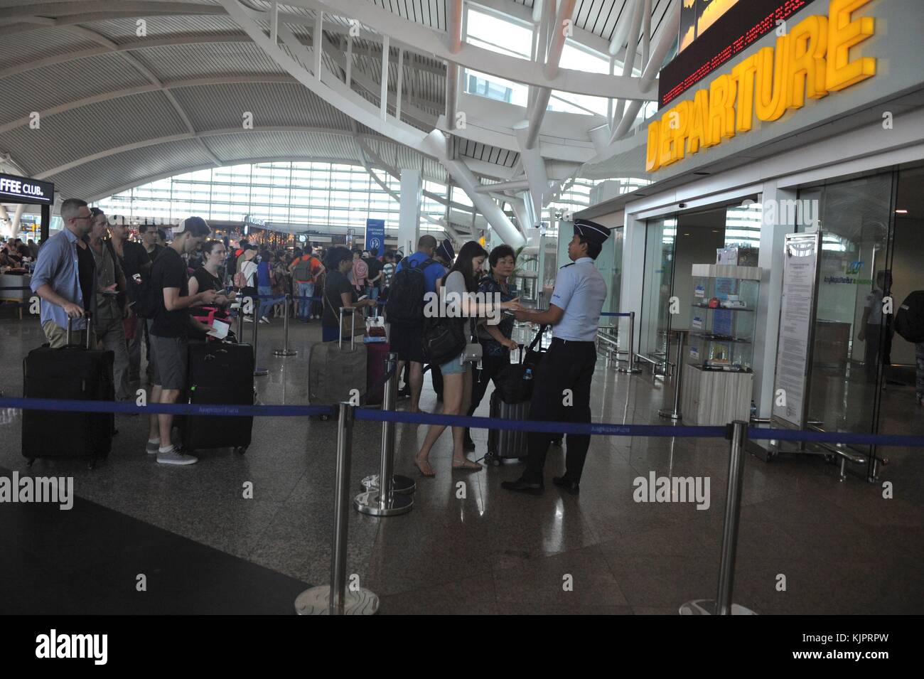 Bali. 30th Nov, 2017. Tourists line up for document check at the Ngurah Rai international Airport in Denpasar, Bali, Indonesia, Nov, 30. 2017. The Indonesian Transport Ministry on Wednesday decided to resume the operation of International Ngurah Rai airport in Bali island after three-day closure as flight alert triggered by volcano eruption has been lowered one level from the highest, an official said. Credit: Zulkarnain/Xinhua/Alamy Live News Stock Photo