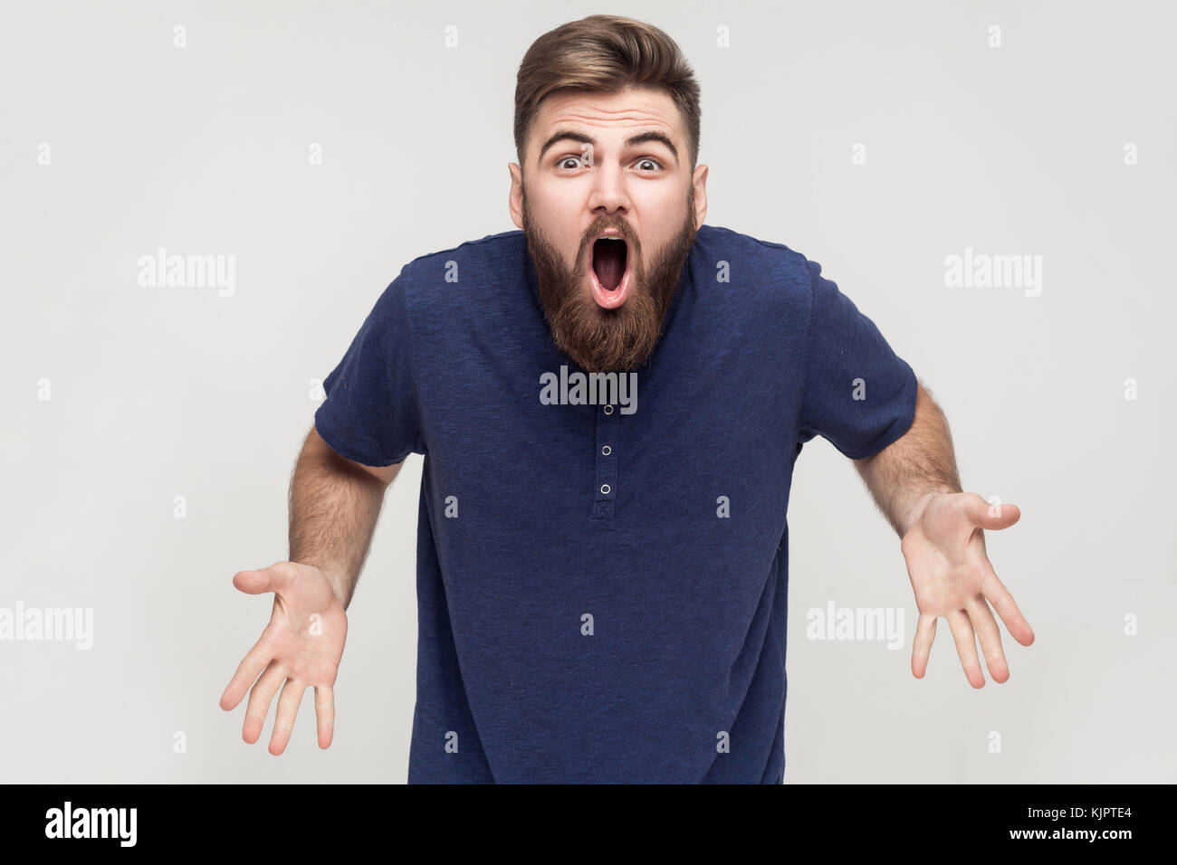 How you did it? It's impossible! Man have a hollywood beard, looking at camera and wery amazement. Stock Photo