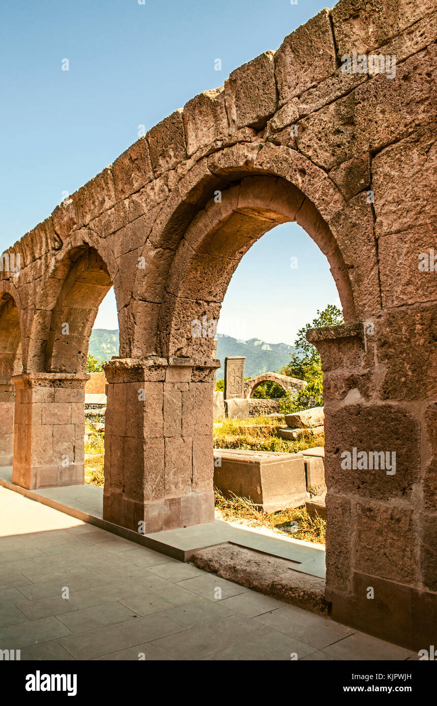 Part of the arched walls surrounding on three sides, the facade of the monastery Odzun Stock Photo