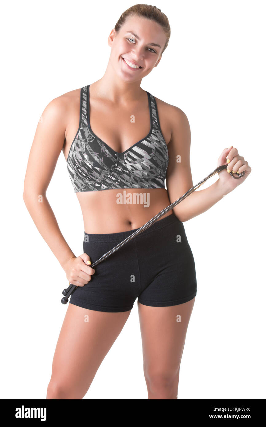 Fit woman holding a jumping rope, isolated in white Stock Photo