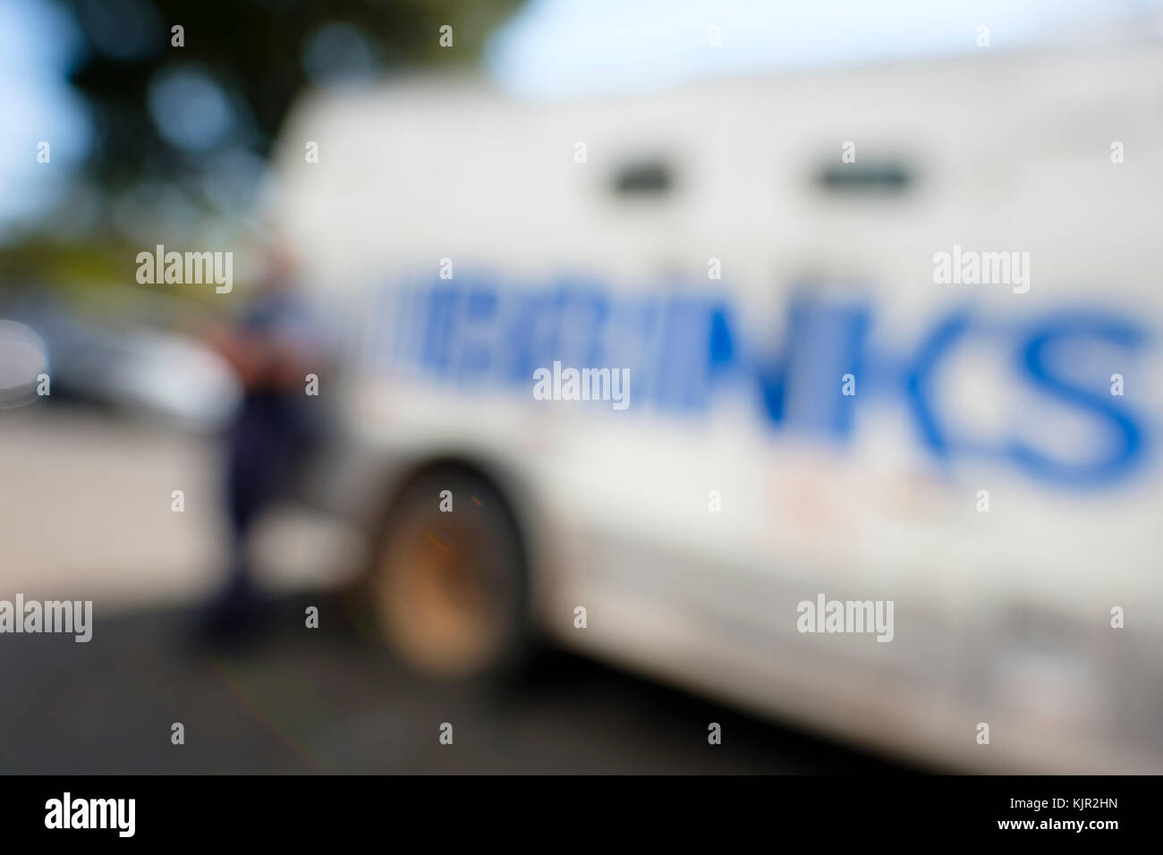 Out of focus photograph of a parked Brinks truck Stock Photo