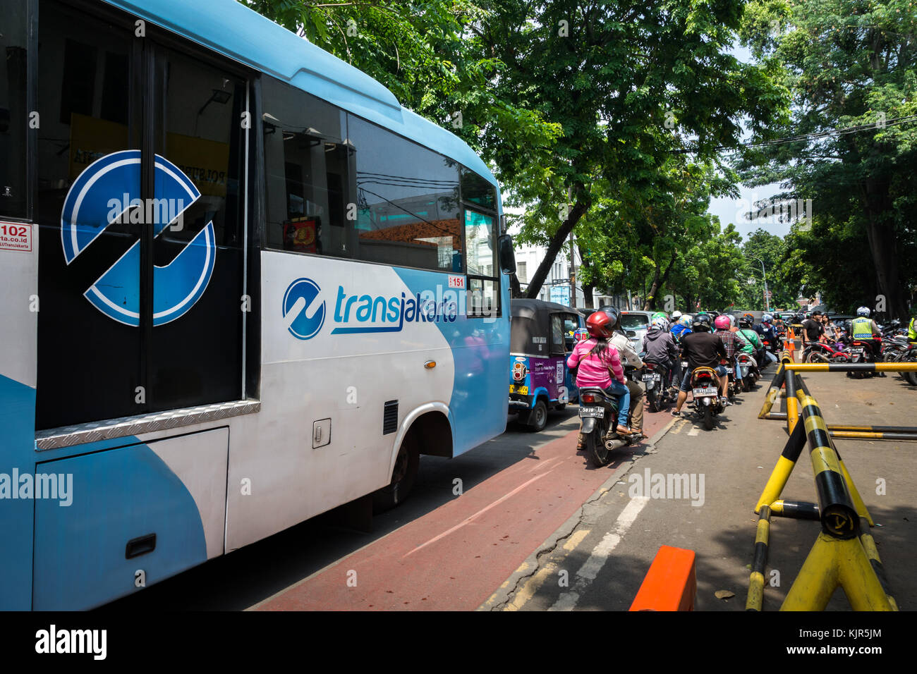 Jakarta, Indonesia - November 2017: Transjakarta bus in downtown Jakarta. Transjakarta is the first BRT (Bus Rapid Transit) system developed in SEA Stock Photo