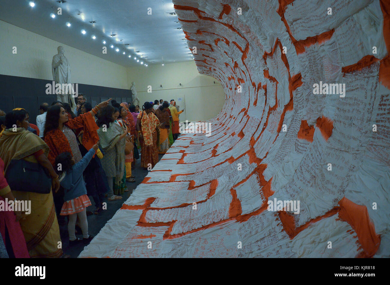 Indian visitors look at a art exhibition on November 24, 2017, in Kolkata, India.Nabaneeta Dev Sen, Padma Shri award-winning Indian poet, novelist and Franziska Greber, a Swiss artist during an inauguration of ' Voices of Courage and Sorrow: Women in the Dark Speak Out' art exhibition on November 24, 2017, in kolkata, India. This event is a part of the sixteen day long International Campaign to Stop Violence against Women and Girls from 25th November 2017 to 10th December 2017 in kolkata, India Nabaneeta Dev Sen, Padma Shri award-winning Indian poet, novelist and Franziska Greber, a Swiss ar Stock Photo