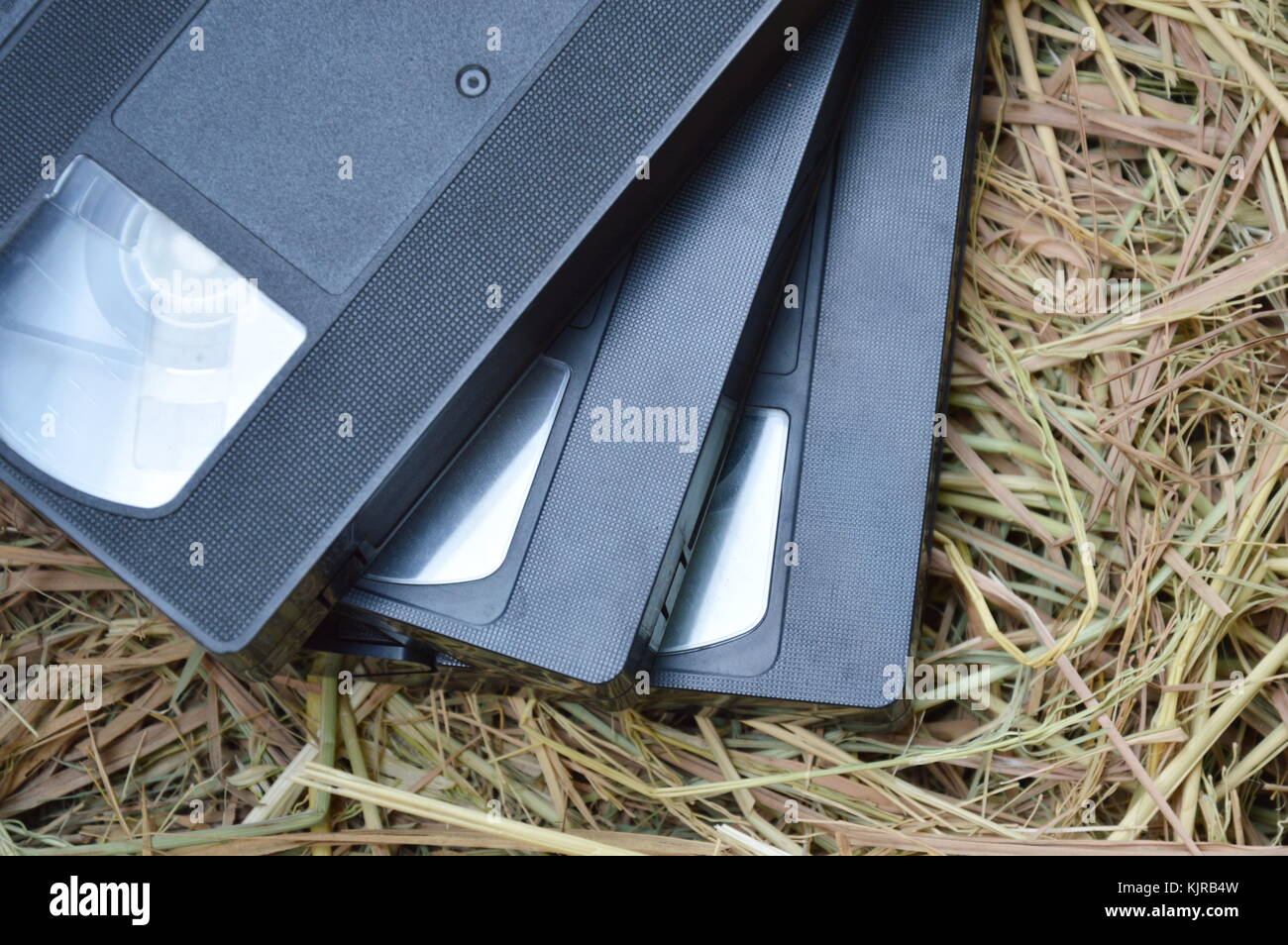 video tape recorder on dry straw in brown paper box Stock Photo Alamy