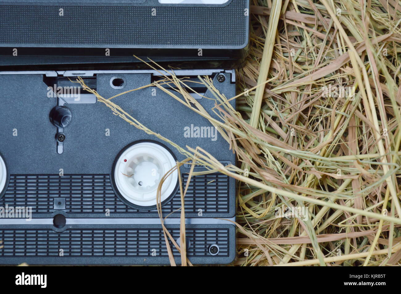 video tape recorder on dry straw in brown paper box Stock Photo Alamy