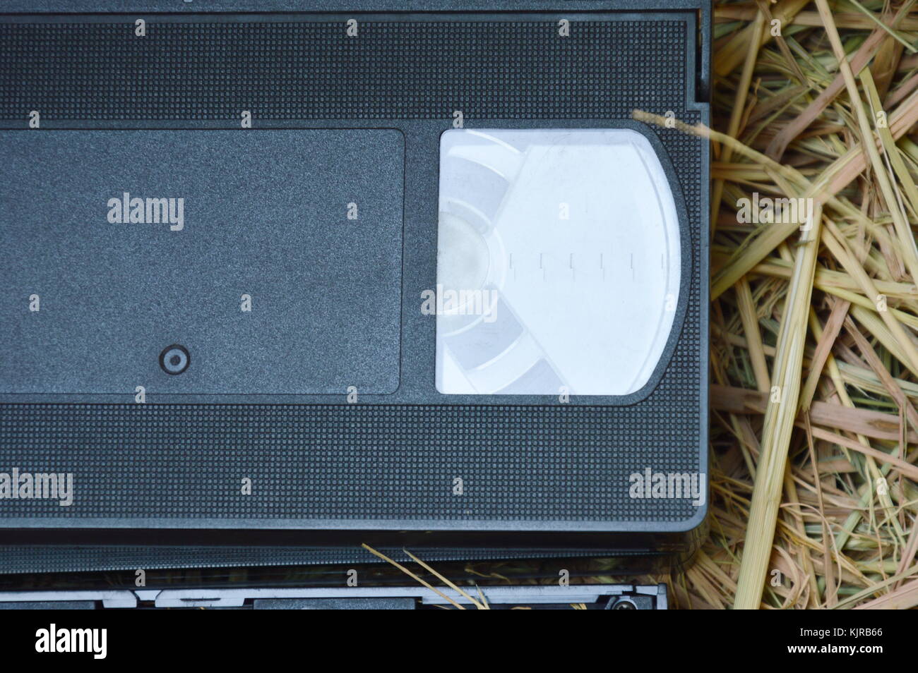 Straw Recorder video tape recorder on dry straw in brown paper box Stock Photo - Alamy
