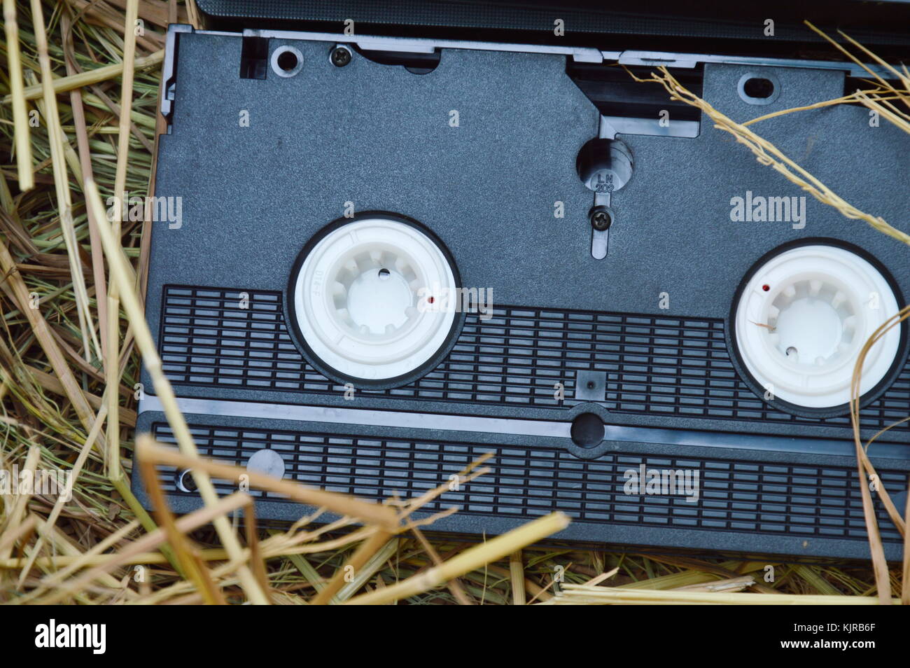 video tape recorder on dry straw in brown paper box Stock Photo Alamy