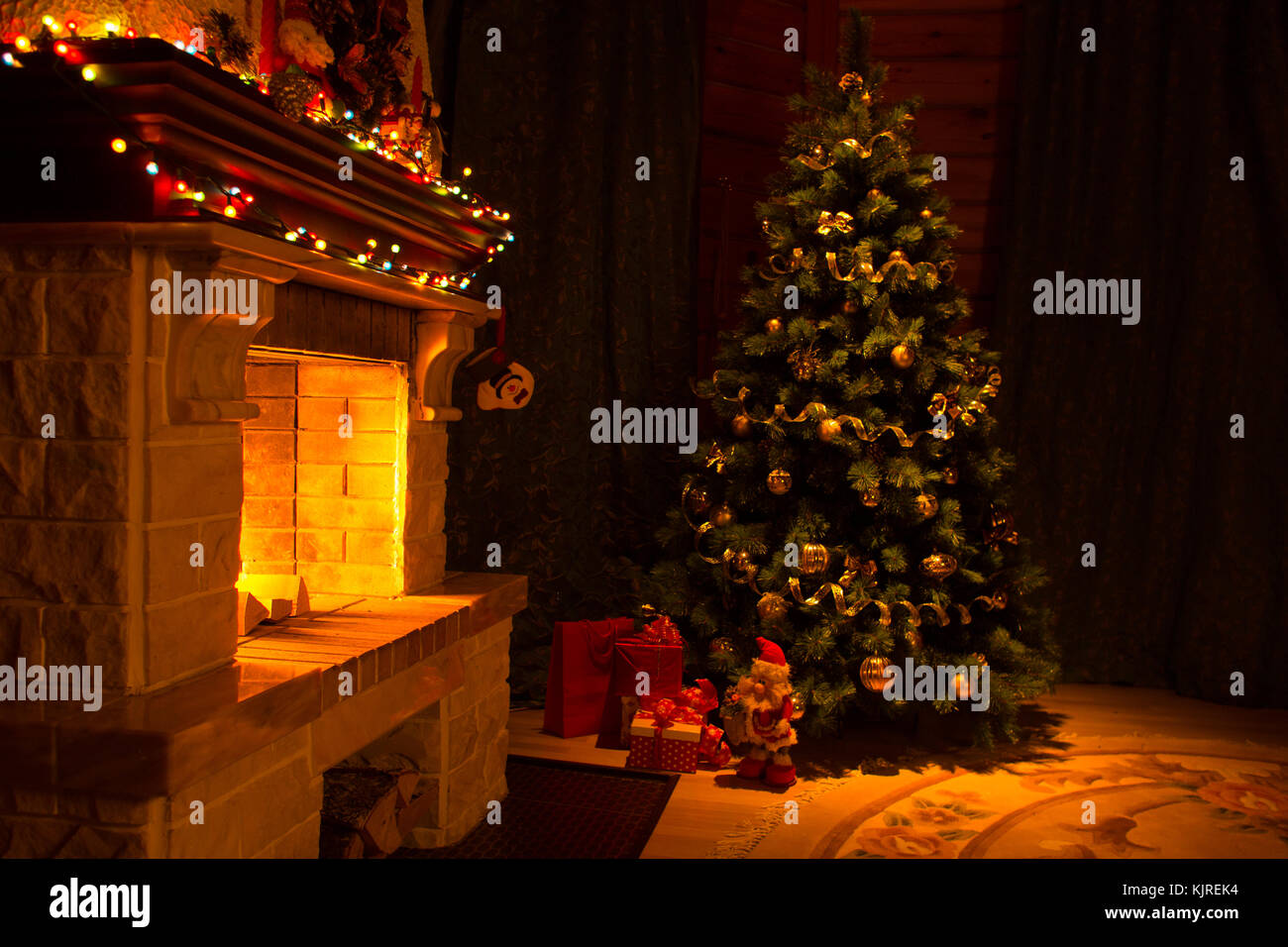Beautiful house decorated for Christmas interior with fireplace Stock Photo