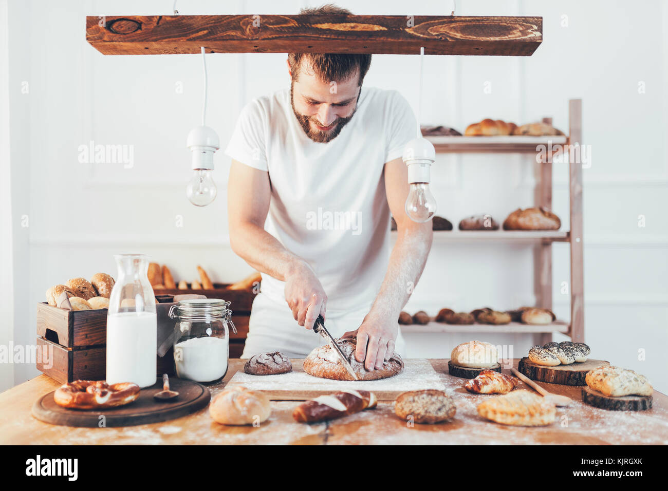 Baker with a variety of healthy and delicious freshly baked bread and