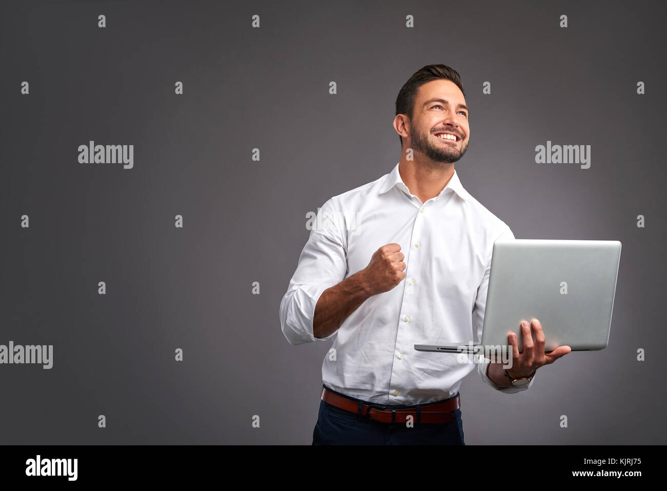 Young man happy celebrating hi-res stock photography and images - Alamy