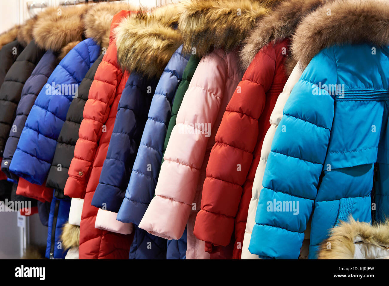 Winter clothing and coat hanger hi-res stock photography and