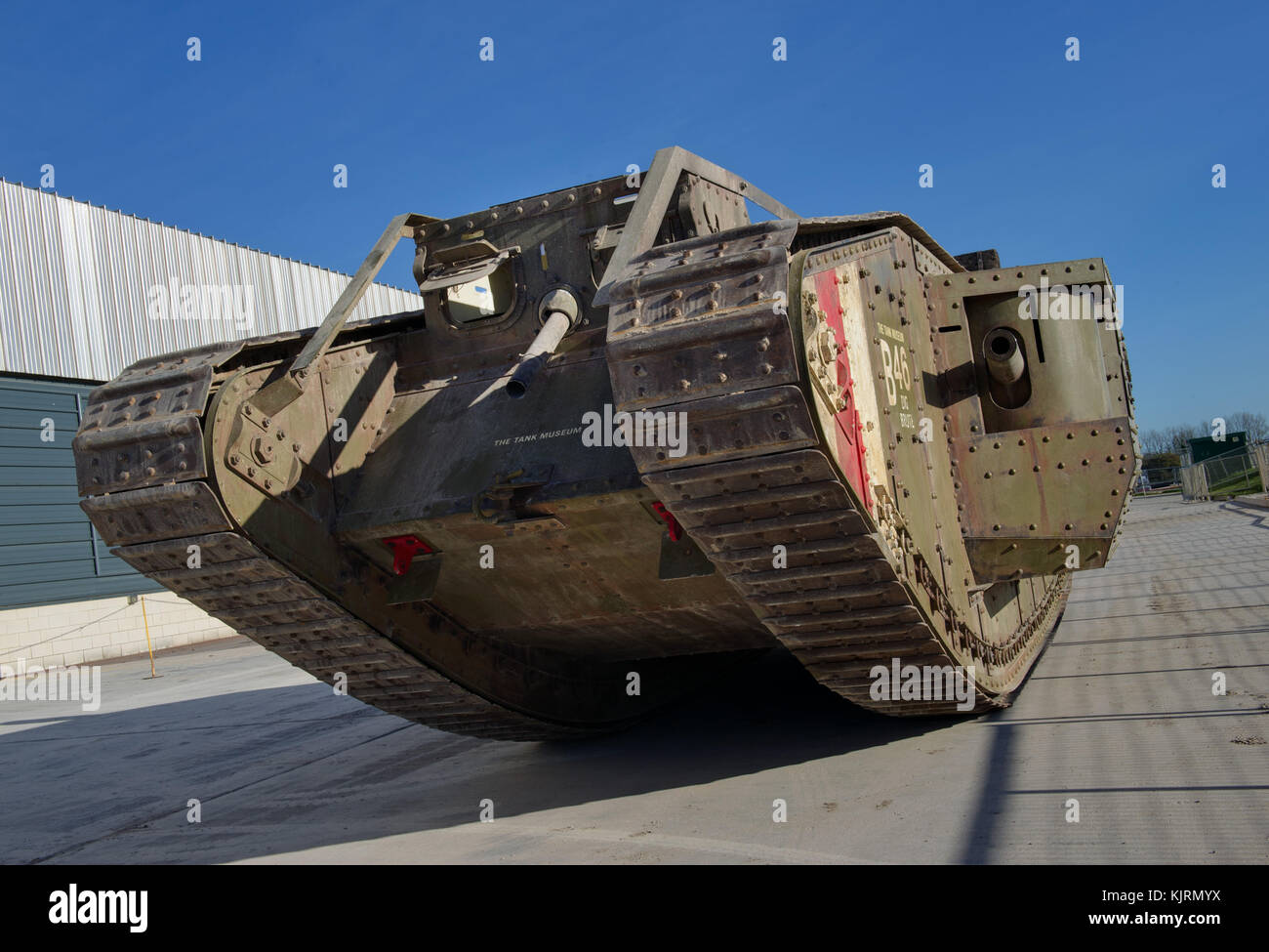 British Mark IV (male) tank (102) with a fascine at The Tank museum and an exact replica (pictured outside) seen with dummy soldiers of the period. Stock Photo