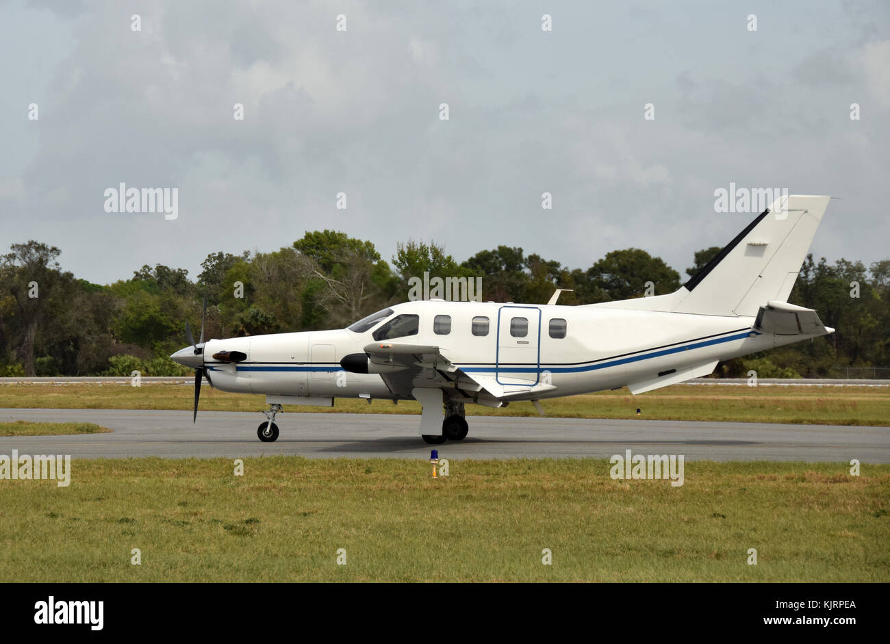 Side view of turboprop airplane on the ground taciing Stock Photo - Alamy